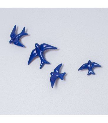 Golondrinas azul klein de cerámica esmaltadas.